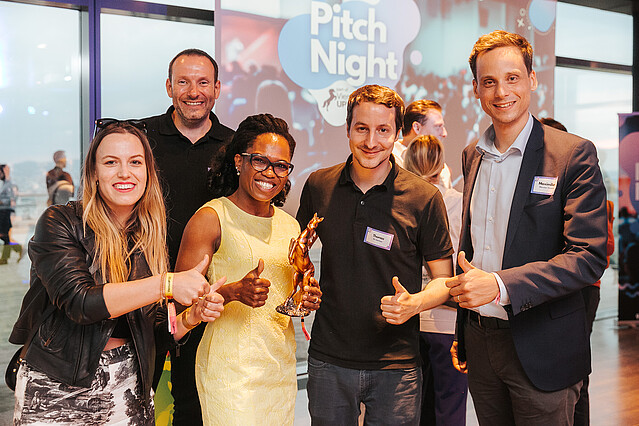 Two women and three men smile for the camera at Startup Pitch Night, an event that was part of ViennaUP 2023.